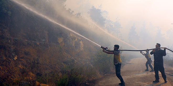 Syrian Civil Defense: Firefighting Teams Continue Efforts to Contain Fires in Latakia Countryside Despite Challenges